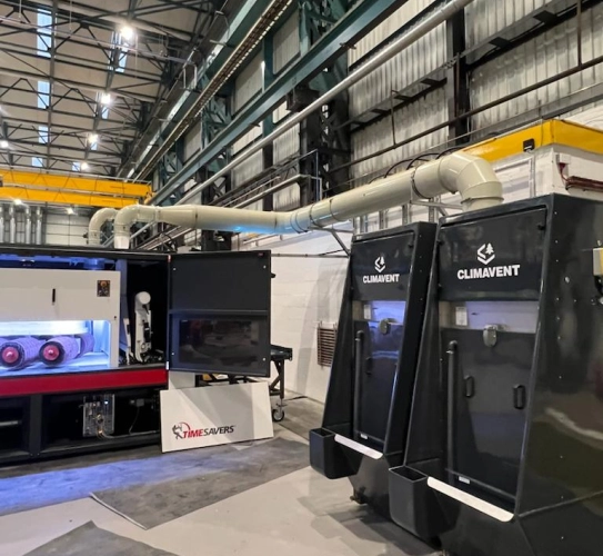 A bank of wet collector units connected onto a Timesaver machine for use during deburring.