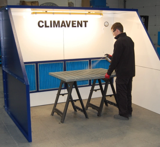 Aerosol extraction using a low profile booth with external extraction unit